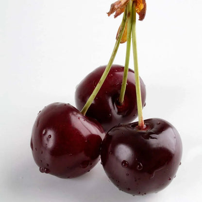 Three cherries with a white background